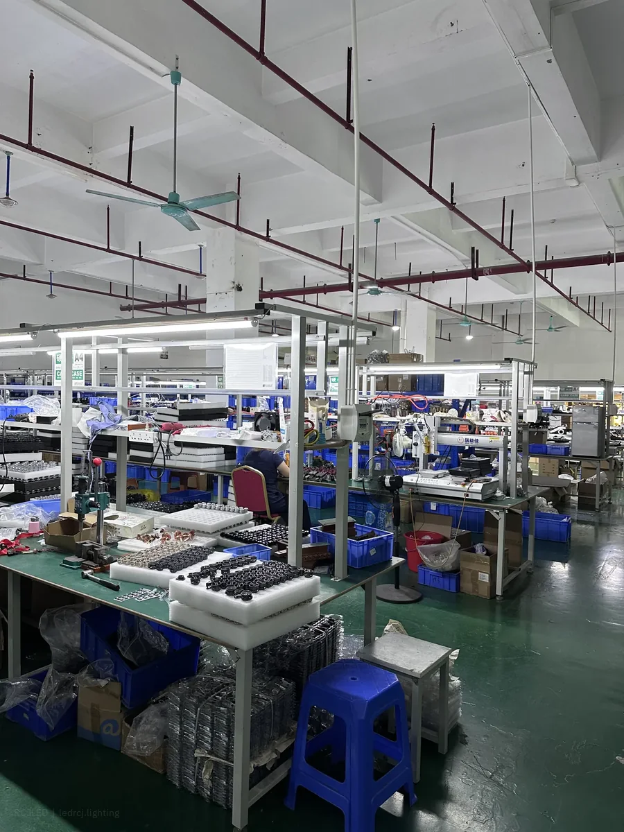 RCJLED assembly workshop with benches and prepared lighting components